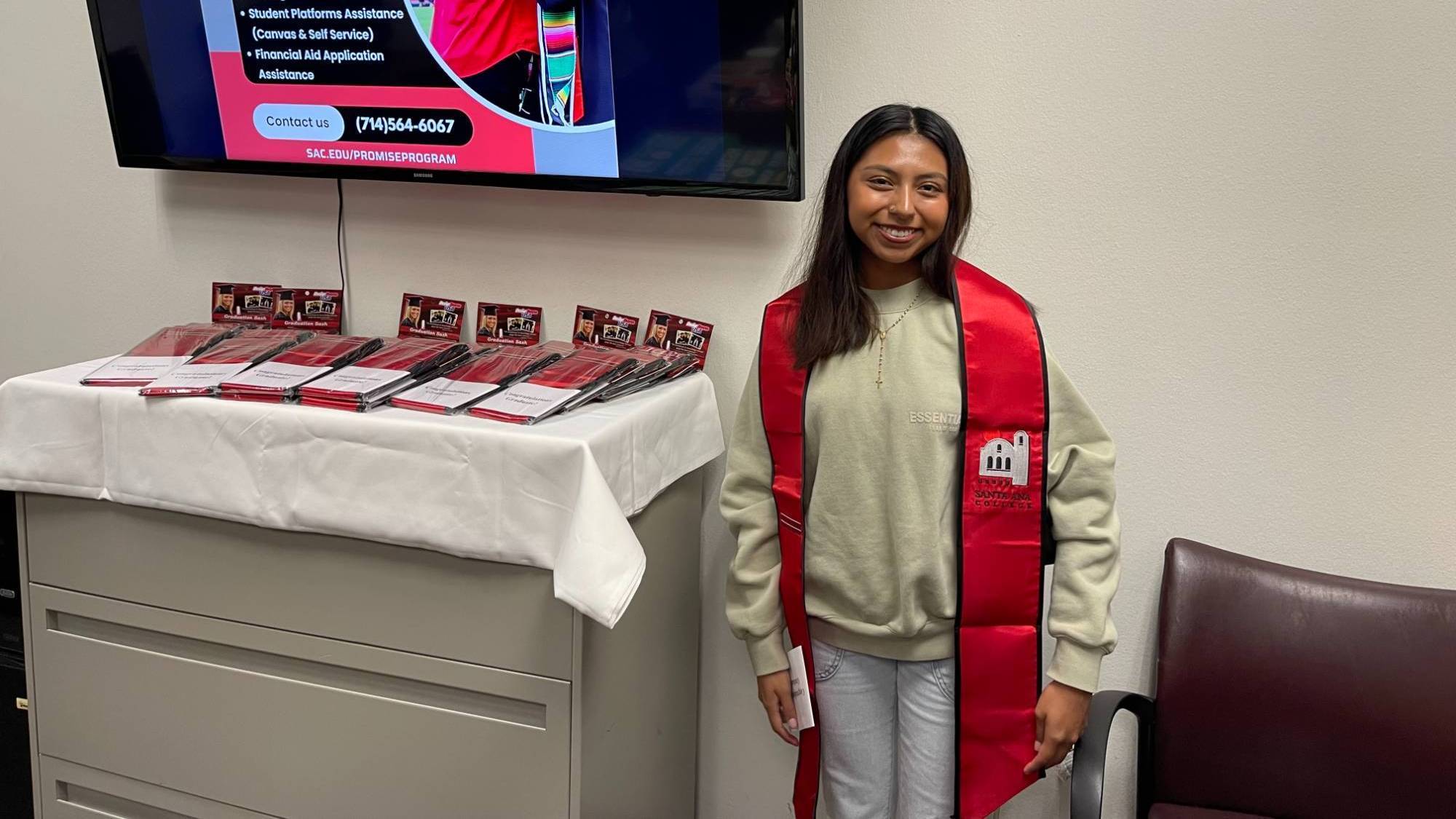 Female student wearing Promise program graduation sash in Promise Center