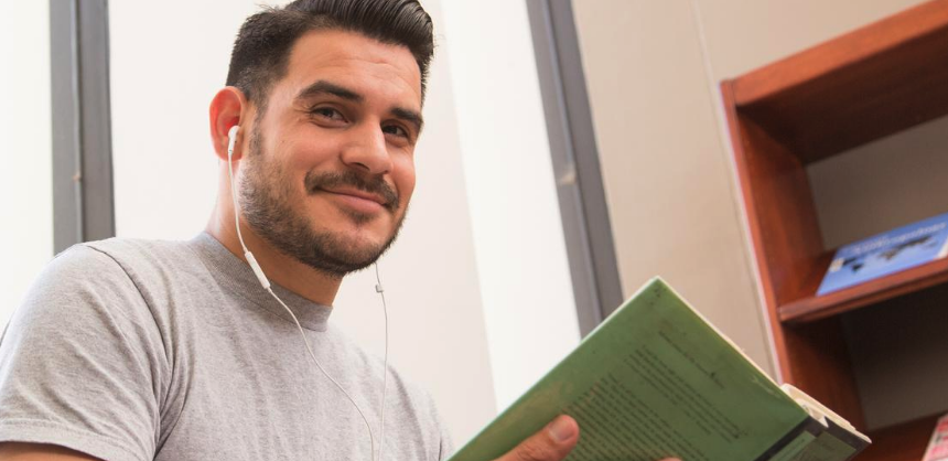 Teaching student reading a book