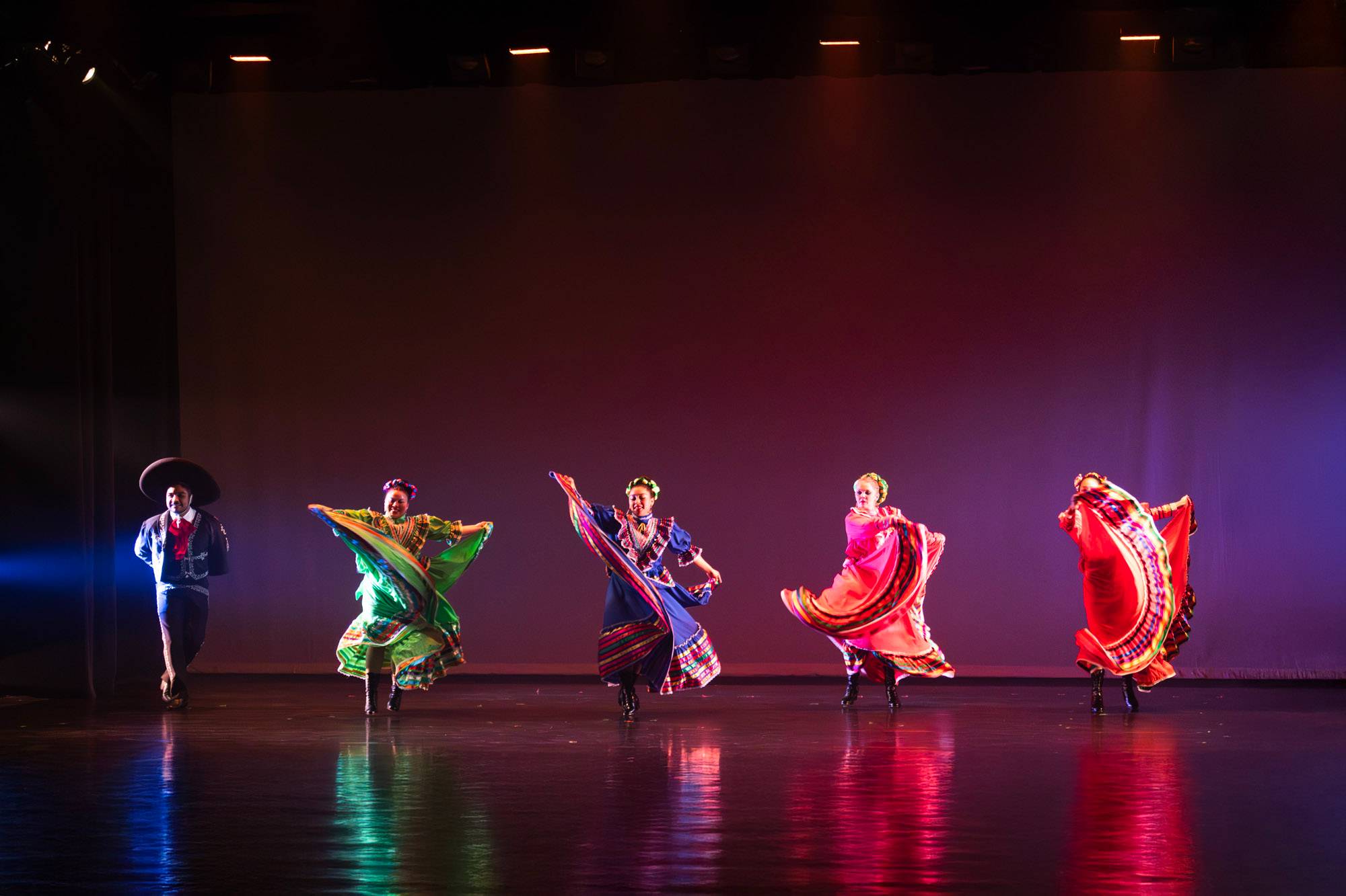 five dancers on stage