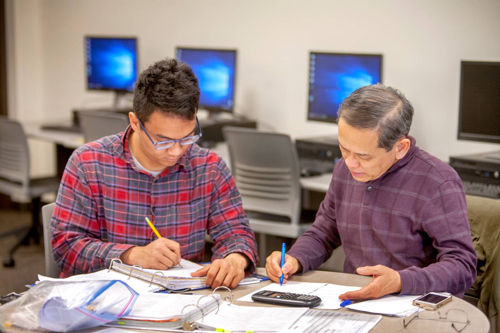 Tutor assisting student