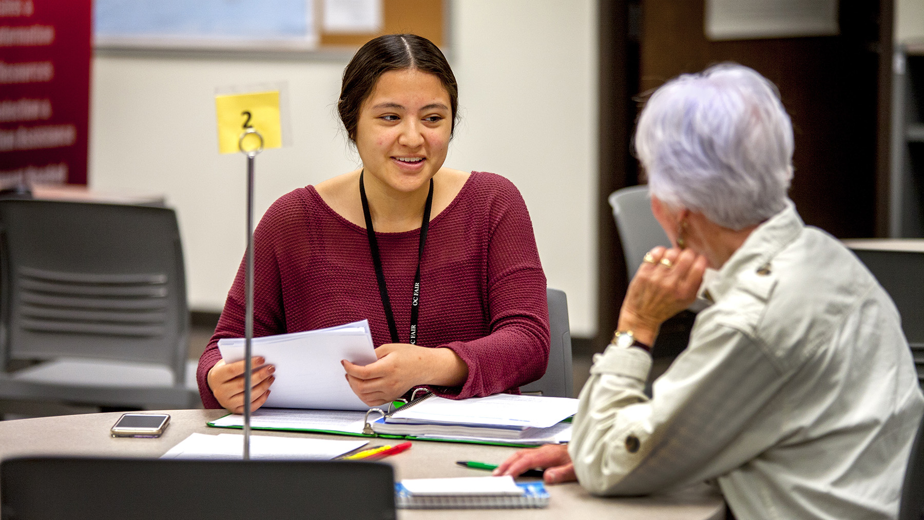 Girl practicing english conversation with tutor