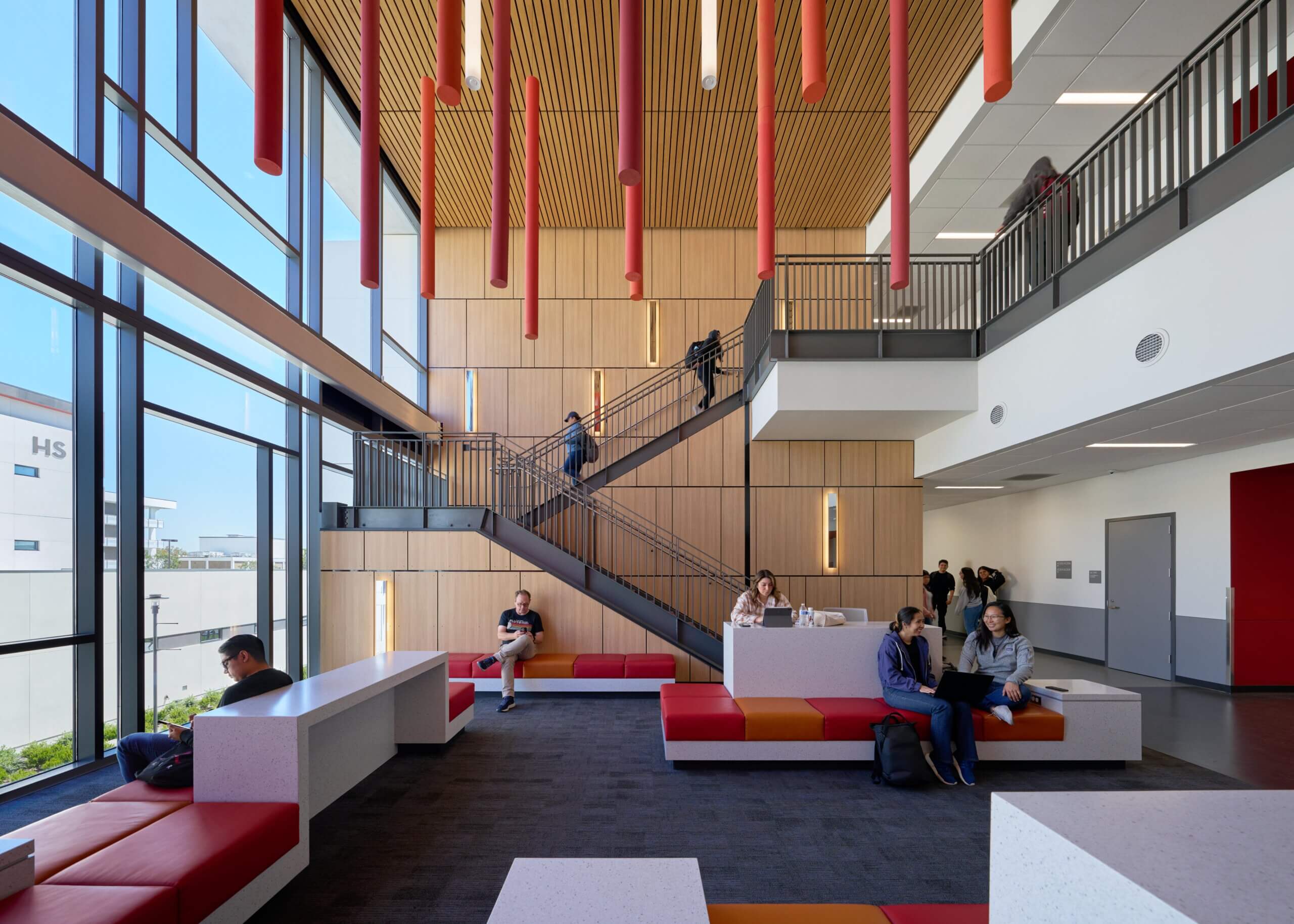 students lounging in science center lobby