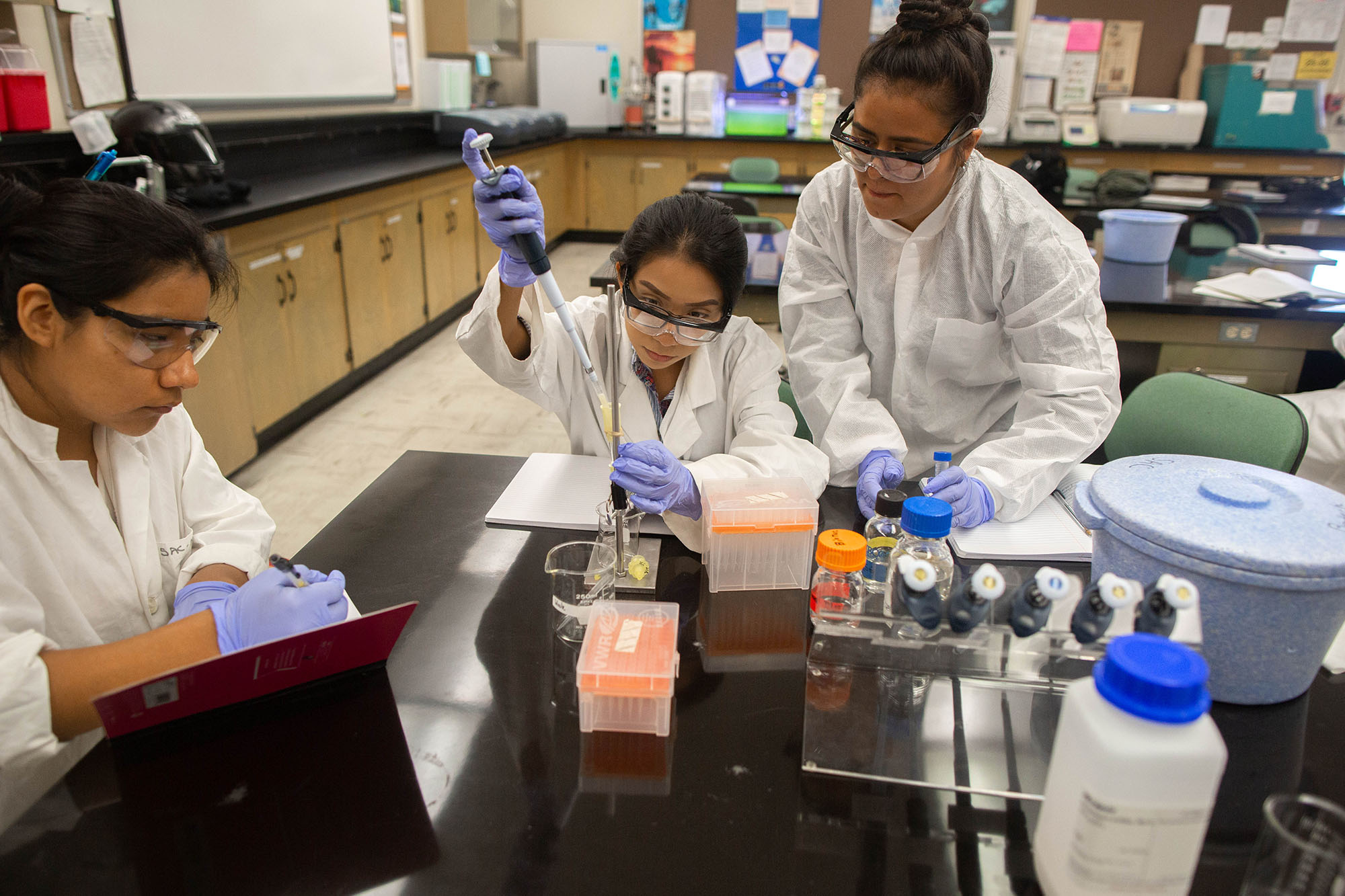 three female chemistry students