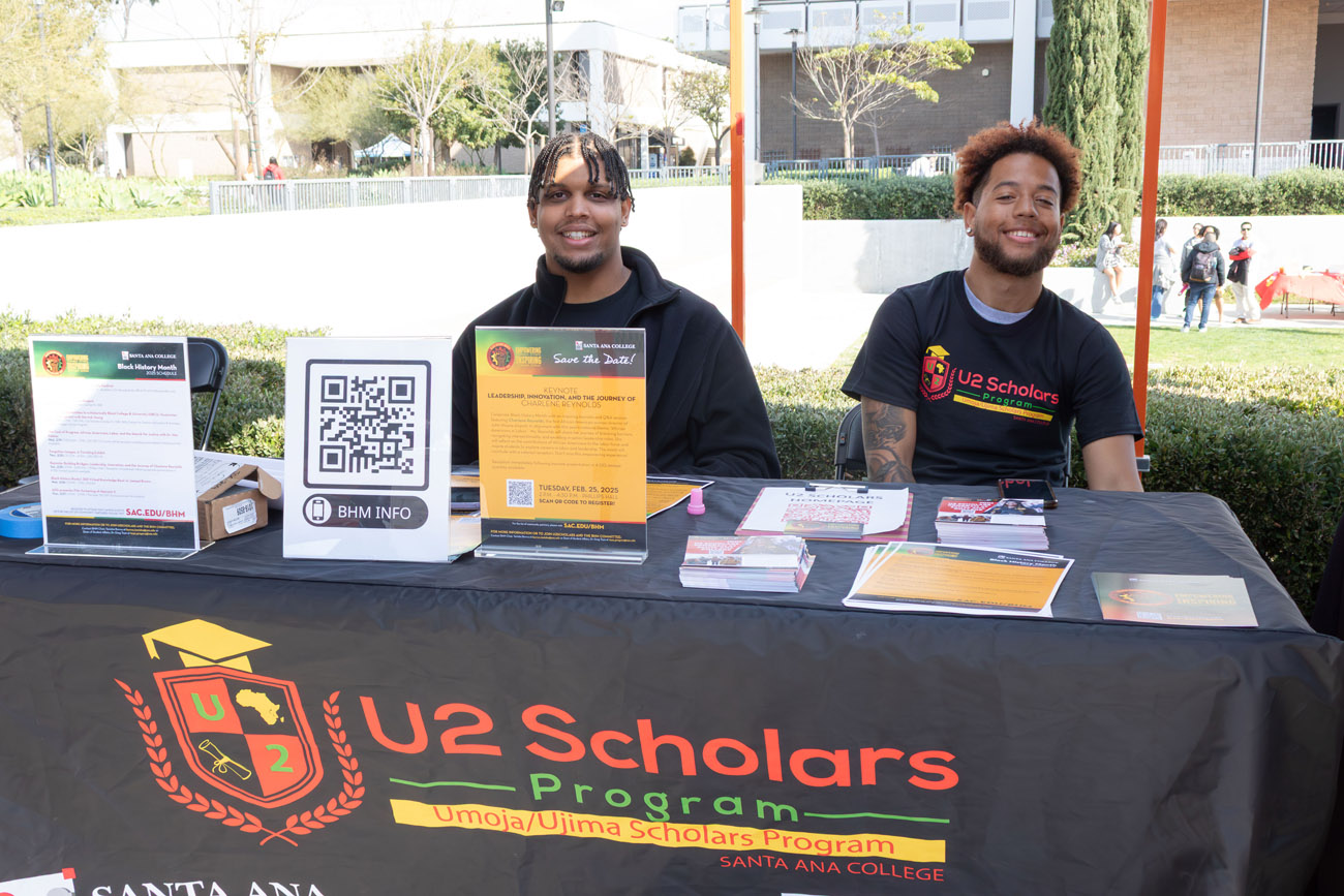 2 male u2 scholars students boothing at club rush