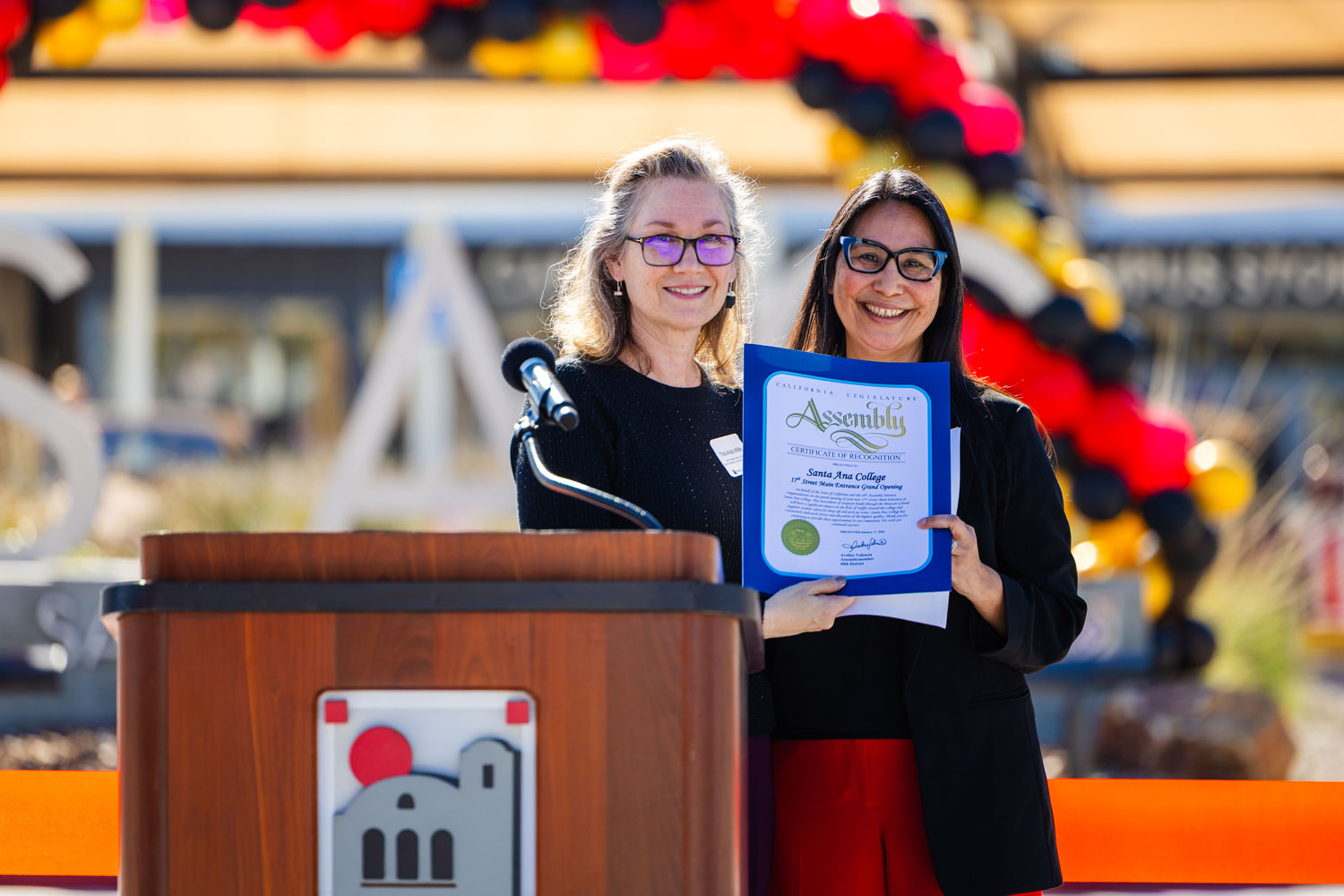 Dr. Nery receiving recognition of new entrance with Tina Arias Miller