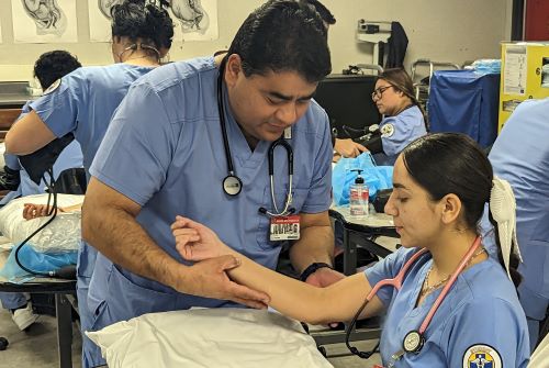 Excited students receiving caregiver personal aide certificates and starting new careers in healthcare in Orange County, California.